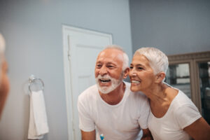 elderly couple showing off teeth