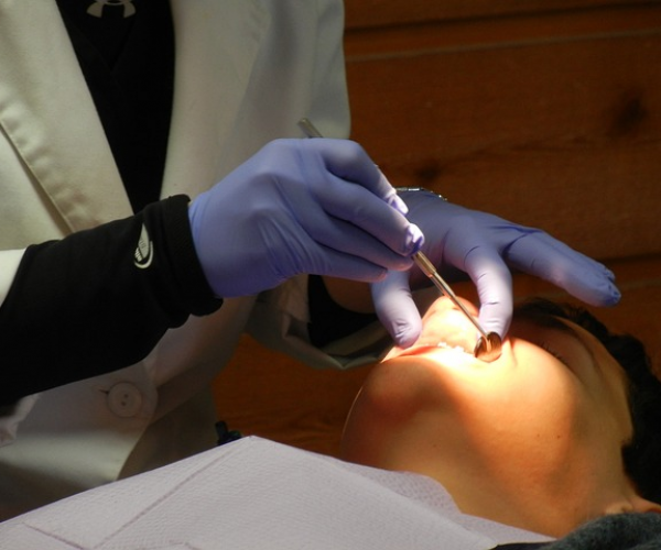 dentist looking at mouth